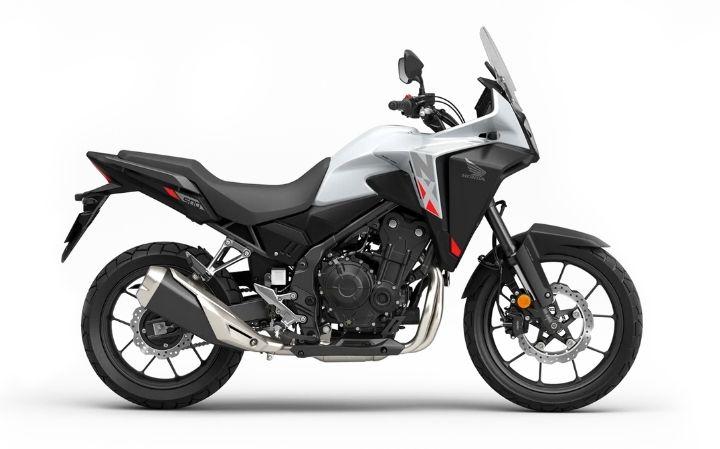 Honda NX500 Caratteristiche del Modello Moto: Tork:43nm., Güç:47hp, Peso:196, Velocità Massima:185, Capacità del Serbatoio: 17.5, Consumo di Carburante: 3.6, Numero di Cilindri:2, Numero di Valvole: 8